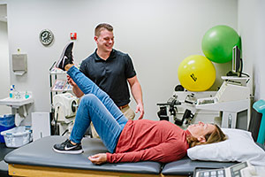 physical therapist Taylor Blattenberger with a patient